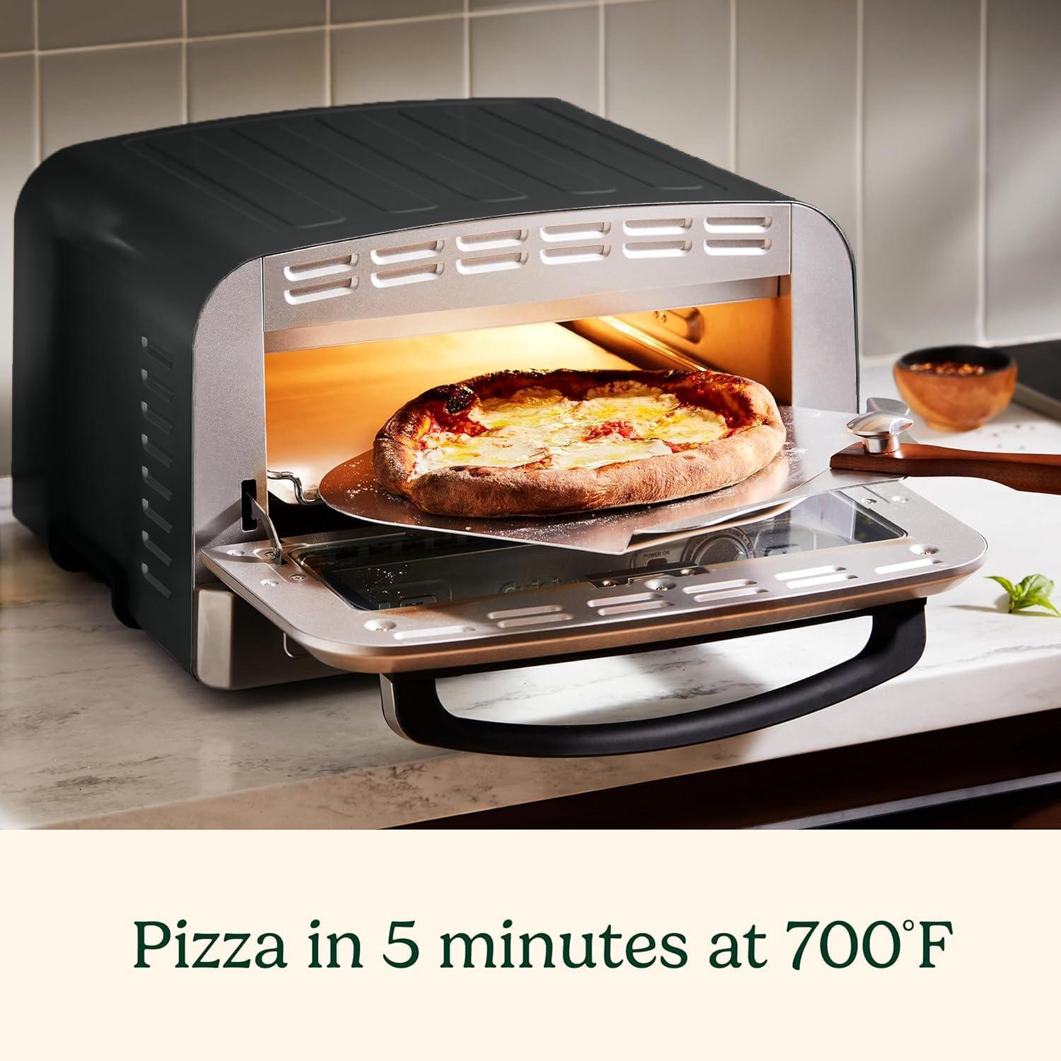 imageCuisinart Indoor Pizza Oven Bakes 12 Pizzas in Minutes Countertop Electric Pizza Oven Heats up to 700F Large Viewing Window Interior Light Includes 125 Pizza Stone CPZ120 Stainless SteelBlack Stainless Steel