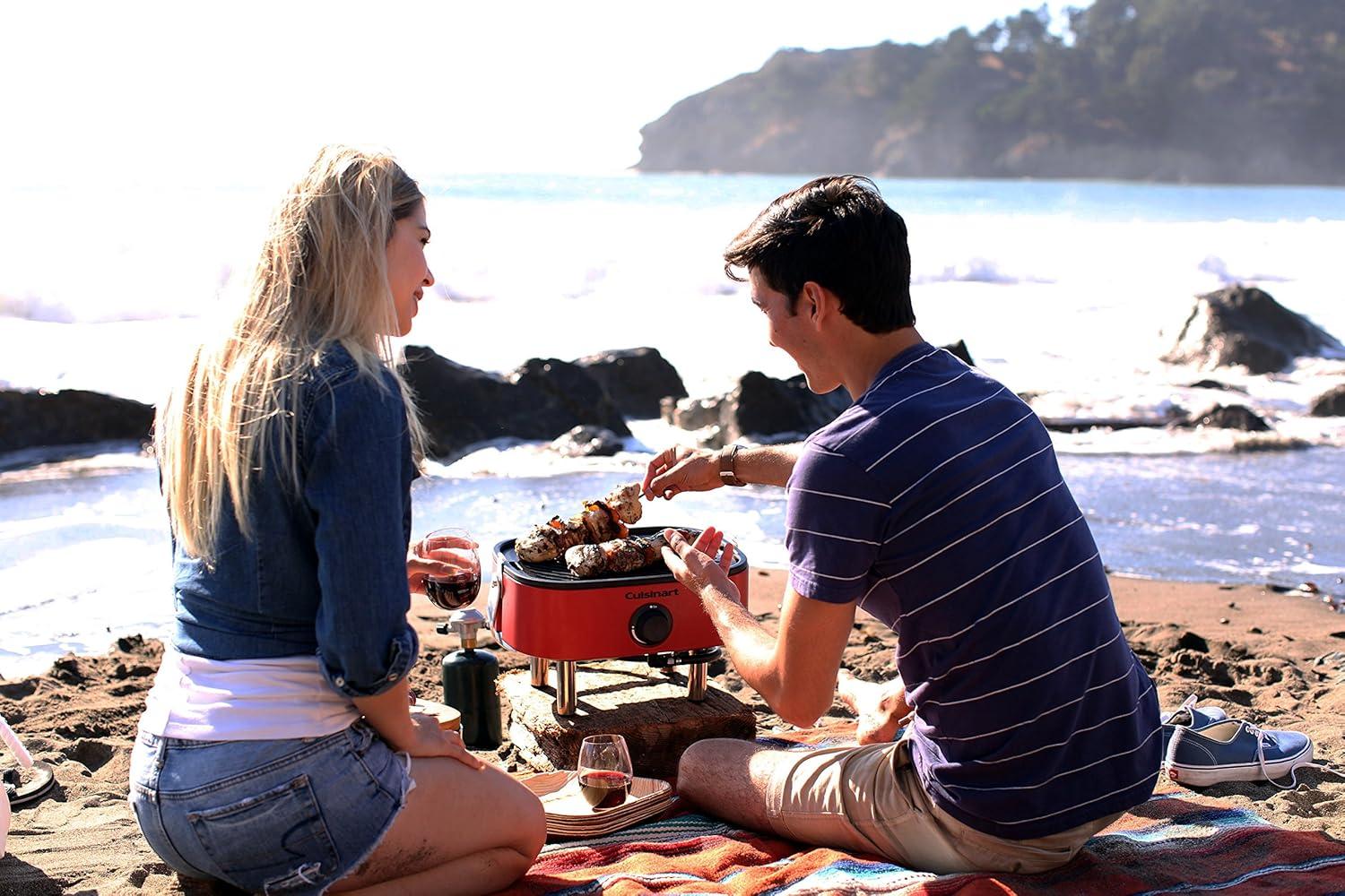 imageCuisinart Venture Portable Gas Grill Small Camping Grill with Cutting Board and Handle Non Stick Porcelain Enameled Cast Iron Grate 9000 BTU Stainless Steel Burner for Camping Tailgates BeachesVenture Gas Grill Red