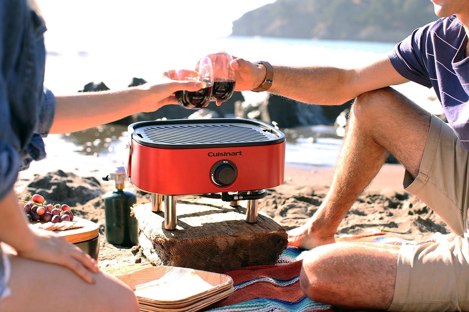 imageCuisinart Venture Portable Gas Grill Small Camping Grill with Cutting Board and Handle Non Stick Porcelain Enameled Cast Iron Grate 9000 BTU Stainless Steel Burner for Camping Tailgates BeachesVenture Gas Grill Red